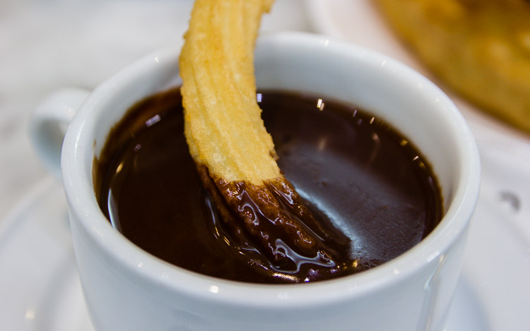 cup of chocolate and churro